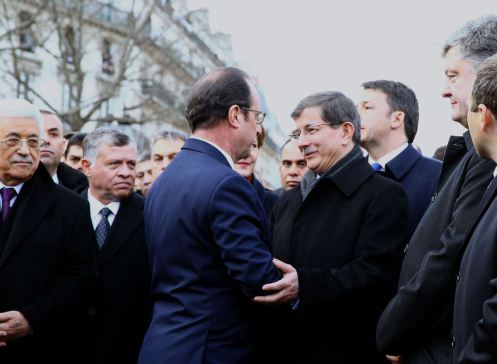 PARIS, FRANCE - JANUARY 11: Turkish Prime Minister Ahmet Davutoglu (center R) talks to French President Francois Hollande (center L) during the Unity March 'Marche Republicaine' in Paris, France on January 11, 2014. (Photo by Hakan Goktepe/Anadolu Agency/Getty Images)